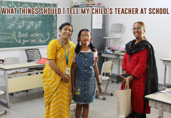 A teacher and parent with child in a classroom