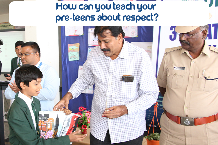 A pre-teen standing beside a man and police man who is teaching him about respect for others