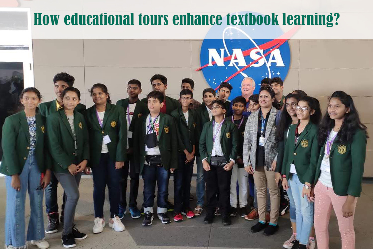 A group of students in green blazers poses at NASA, highlighting the benefits of educational tours.