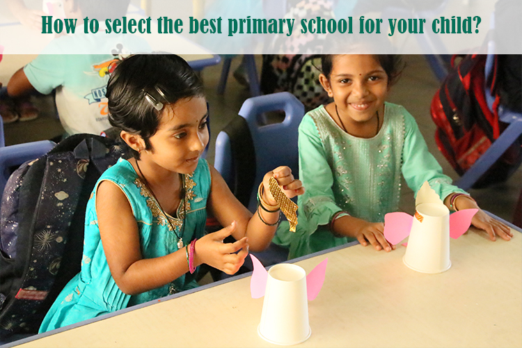 Two children engaged in a classroom activity in the best primary school for kids.