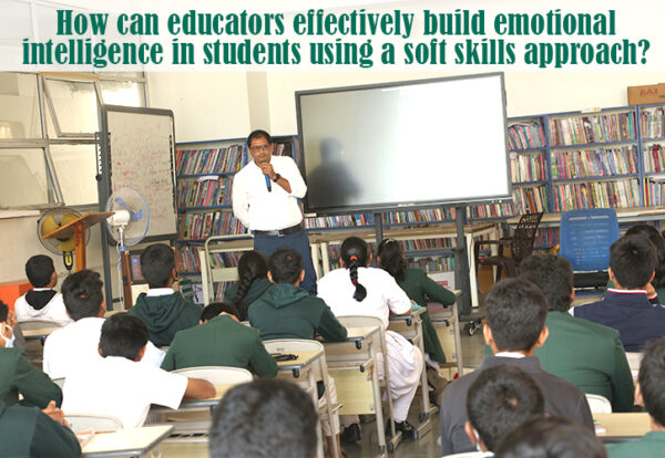 A person standing in front of a classroom teaching emotional intelligence to students.