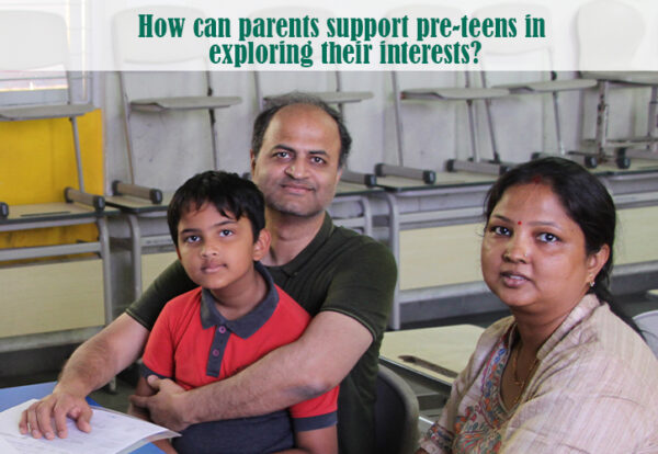 A Delhi Public School DPS Warangal parent and a child sitting at a desk exploring their child interests.