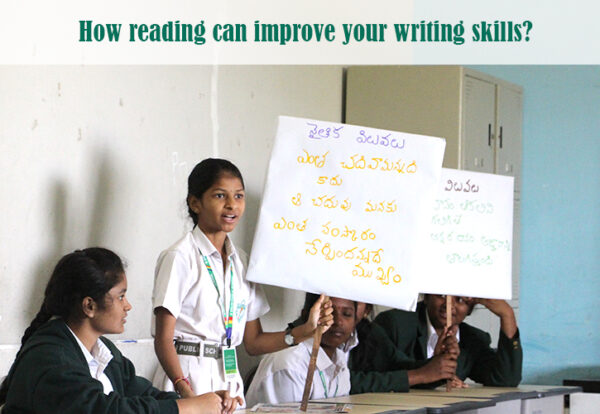 A group of students holding signs to showcase their writing skills.