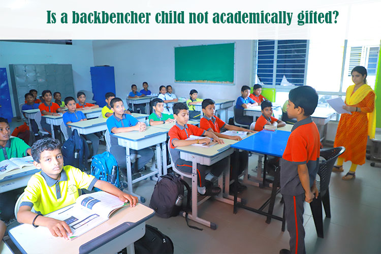 A group of backbencher children in a classroom.