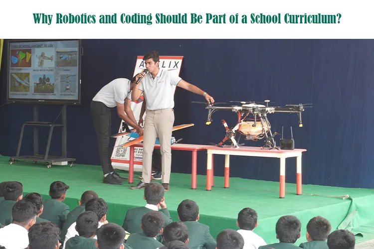 A group of students on stage presenting robotics projects.