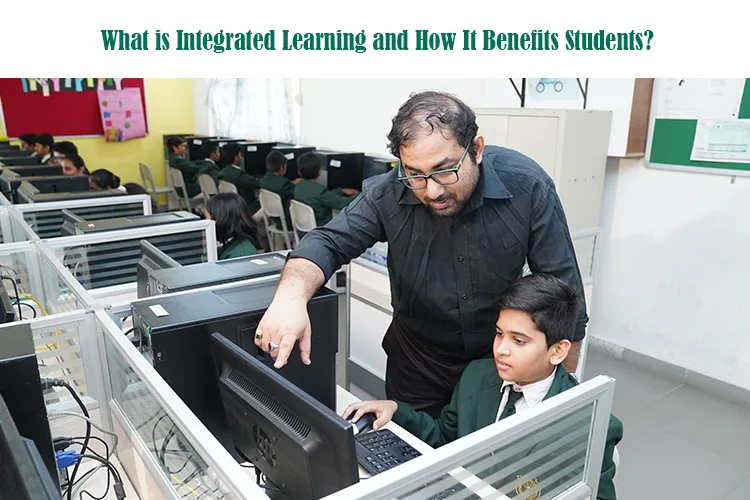 integrated learning in a classroom setting, teacher helping student with computer work