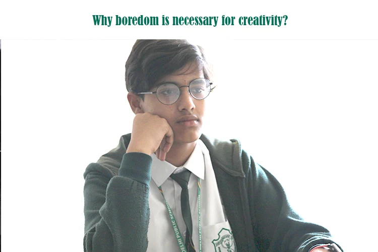 Child exploring creativity during unstructured, screen-free time at home.