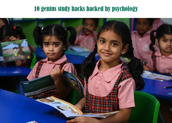 Two young female students in uniform smiling while holding books in a classroom, representing the success of effective study techniques.