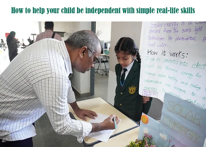 Parent or teacher reviews a student's project on solar energy, demonstrating how to help a child be independent with real-life skills