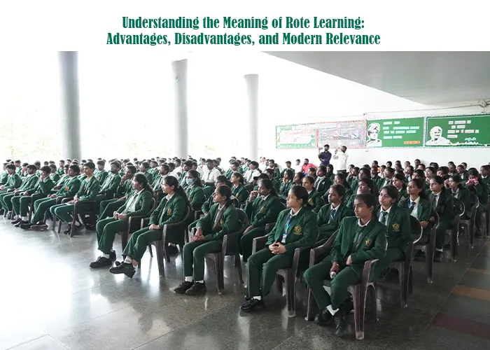 Students seated in rows during a school assembly or lecture, representing a traditional classroom environment often associated with rote learning practices.